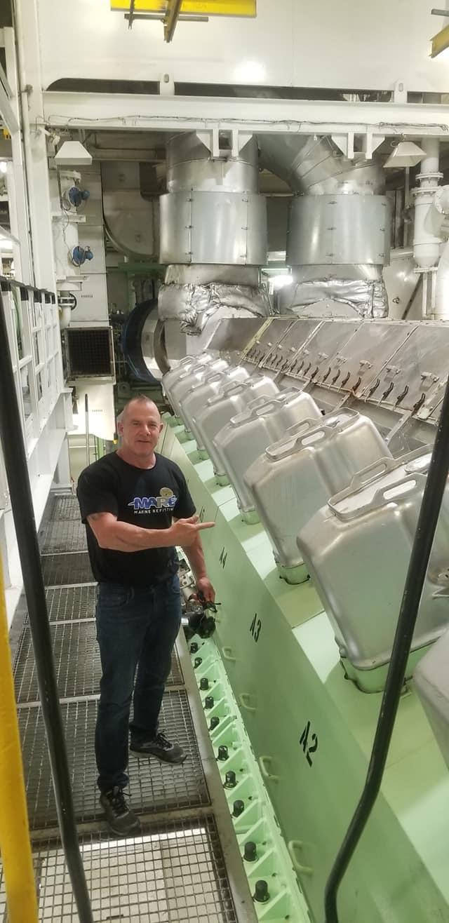 Jason in an engine room aboard a vessel in Italy